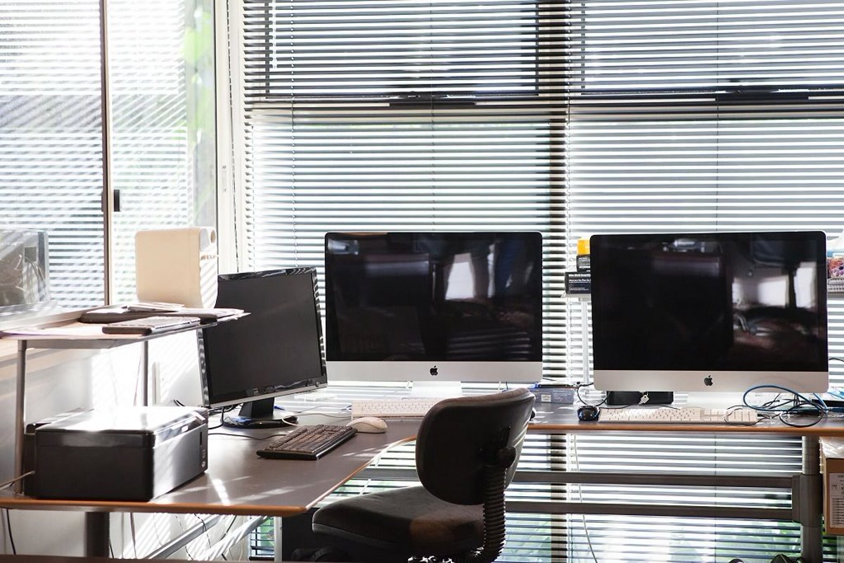 Computers, keyboards and an office chair in the company's Coorparoo office.
